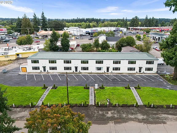 Aerial view of the Plainsmen Apartments building and parking lot